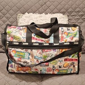 LeSportsac Pink and Black Travel Bag with Vibrant Design